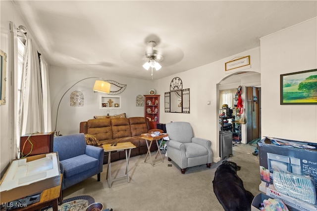 living room featuring ceiling fan and light carpet