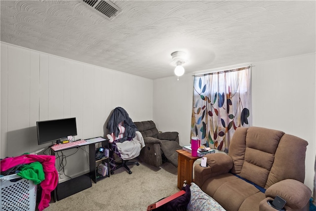 living room with carpet flooring and a textured ceiling