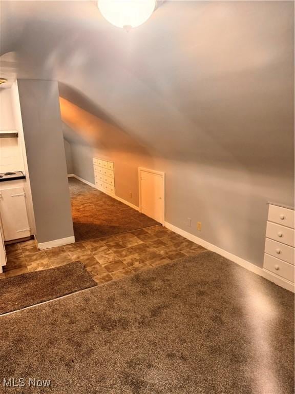 bonus room featuring vaulted ceiling