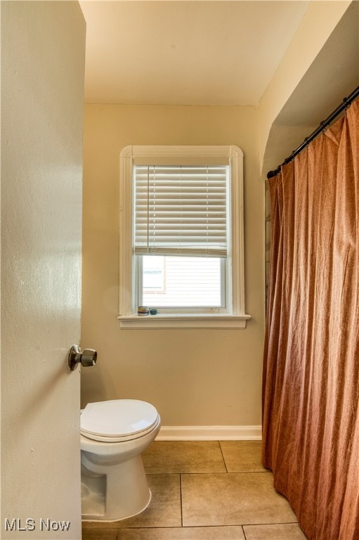 bathroom featuring tile patterned flooring and toilet