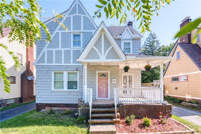 tudor house with covered porch