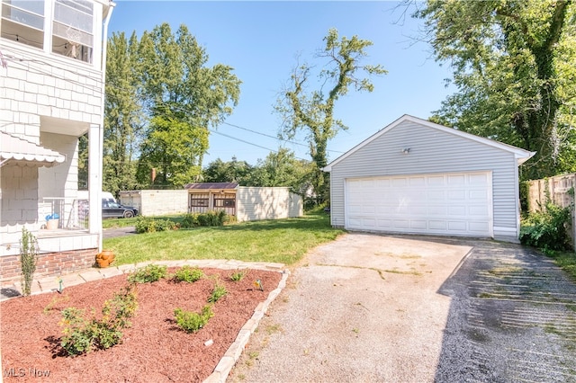 garage featuring a yard