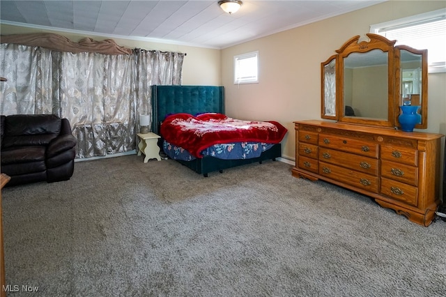 bedroom featuring crown molding and carpet