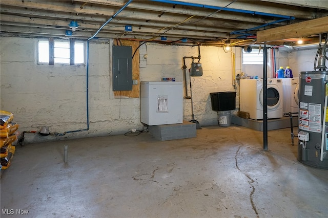 basement with gas water heater, electric panel, and washing machine and dryer