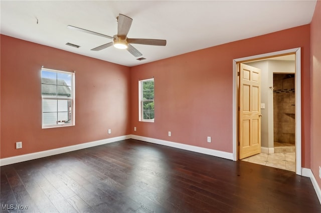 spare room featuring ceiling fan and hardwood / wood-style floors