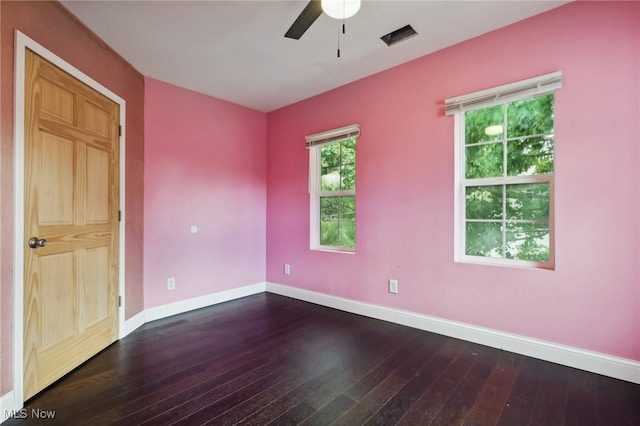 unfurnished room with ceiling fan and dark hardwood / wood-style flooring