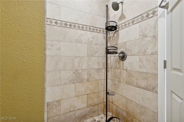 details featuring a tile shower