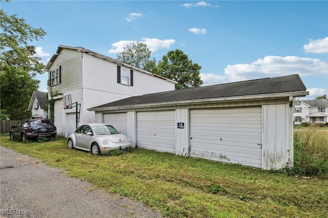 garage featuring a lawn