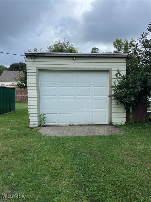 garage with a lawn