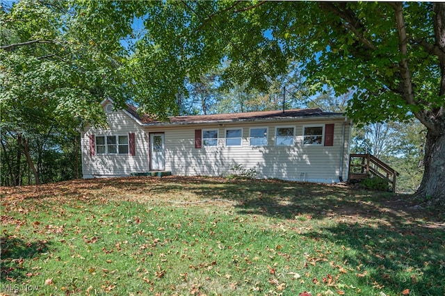 ranch-style home with a front lawn