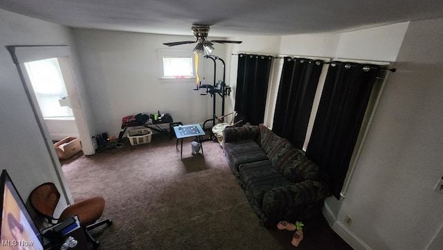 carpeted living room with ceiling fan