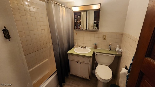 full bathroom featuring toilet, tile walls, shower / bath combination with curtain, tasteful backsplash, and vanity