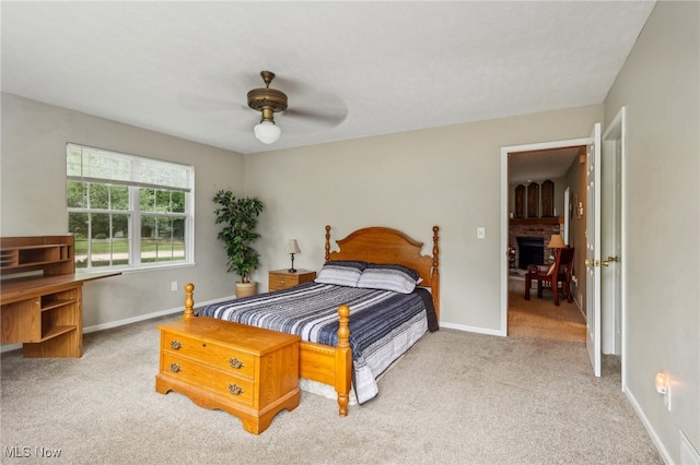 bedroom featuring light colored carpet and ceiling fan