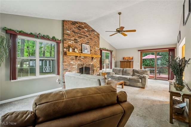 living room with carpet, ceiling fan, lofted ceiling, and a fireplace