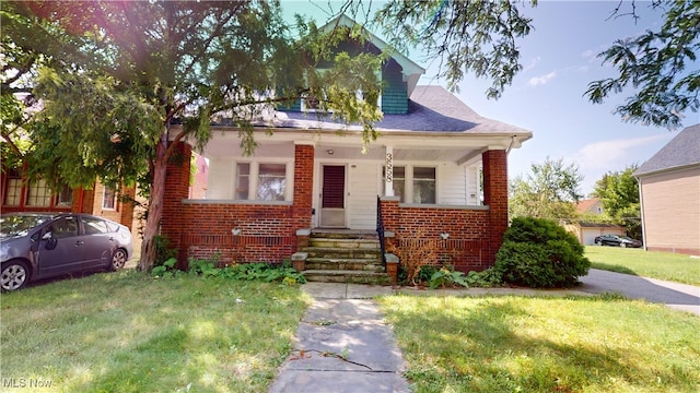 bungalow-style house featuring a front yard and a porch