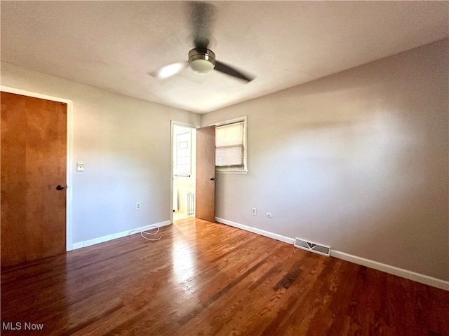 unfurnished bedroom with hardwood / wood-style flooring and ceiling fan