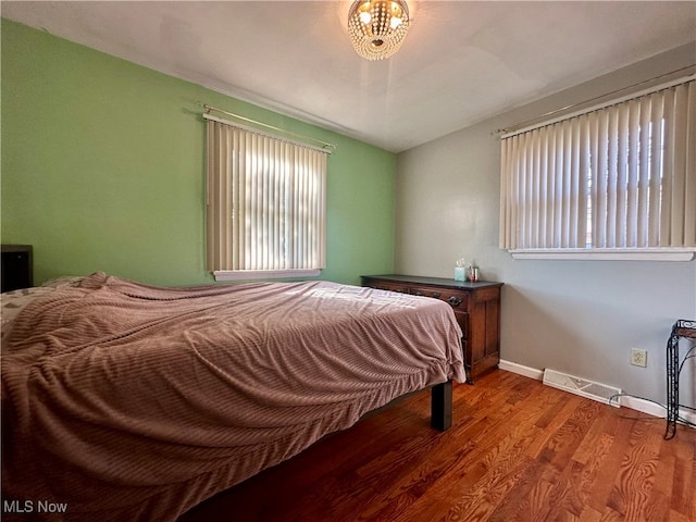 bedroom with hardwood / wood-style flooring