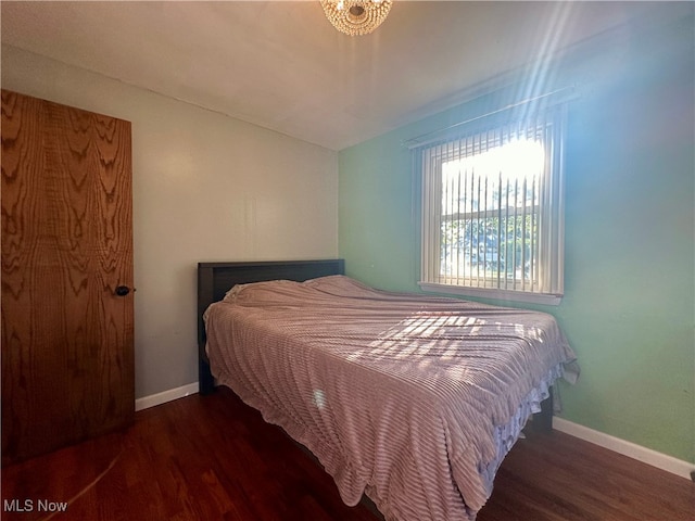 bedroom featuring dark wood-type flooring