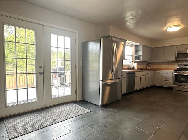 kitchen with sink, stainless steel appliances, and french doors