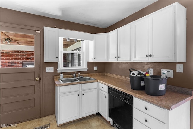 kitchen with a wealth of natural light, dishwasher, sink, and white cabinetry