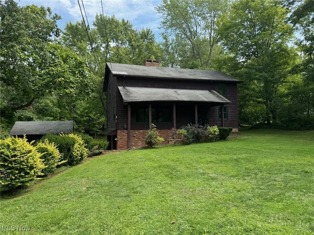 view of outdoor structure featuring a yard