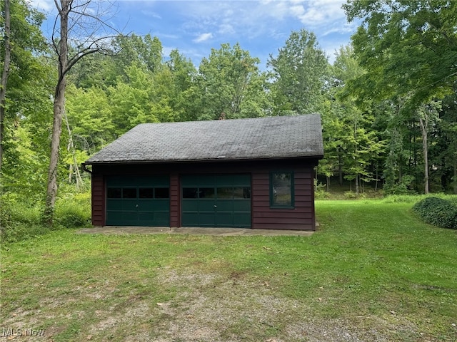 garage featuring a yard