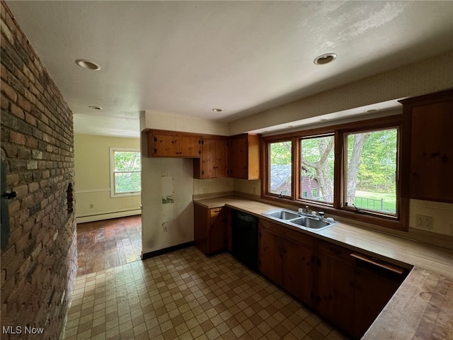 kitchen with a baseboard heating unit, dishwasher, sink, and hardwood / wood-style floors