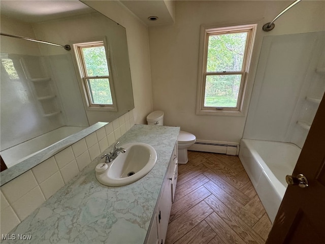 full bathroom featuring toilet, vanity, parquet flooring, shower / bath combination, and a baseboard heating unit