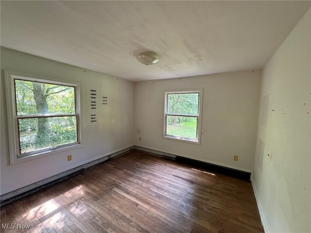 spare room with dark hardwood / wood-style flooring