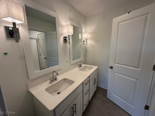 bathroom with tile patterned flooring and vanity