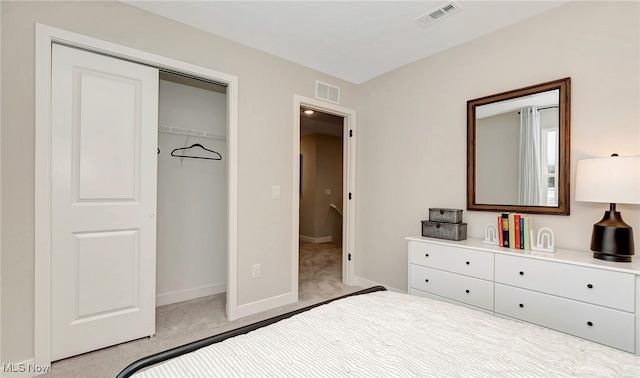 carpeted bedroom with a closet