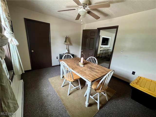 dining area with a textured ceiling, a baseboard radiator, and ceiling fan