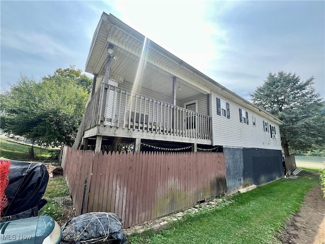 view of home's exterior featuring a wooden deck