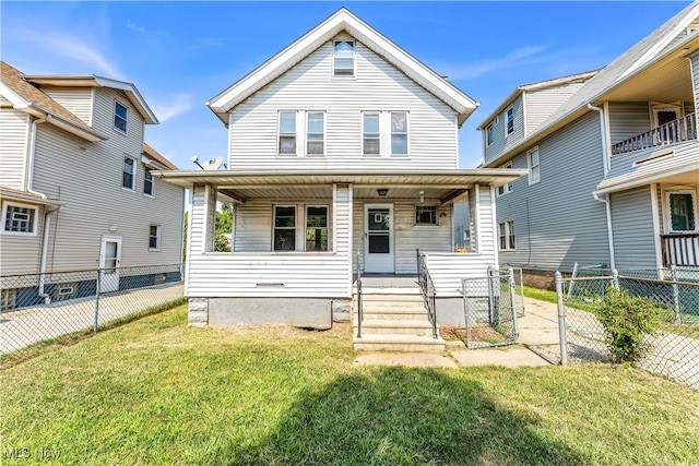 view of front of home with a balcony, covered porch, and a front yard