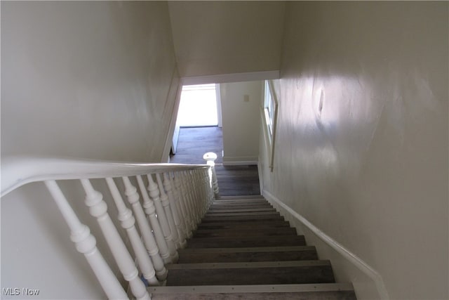 stairway featuring hardwood / wood-style floors