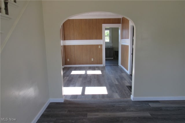 hallway with dark hardwood / wood-style flooring