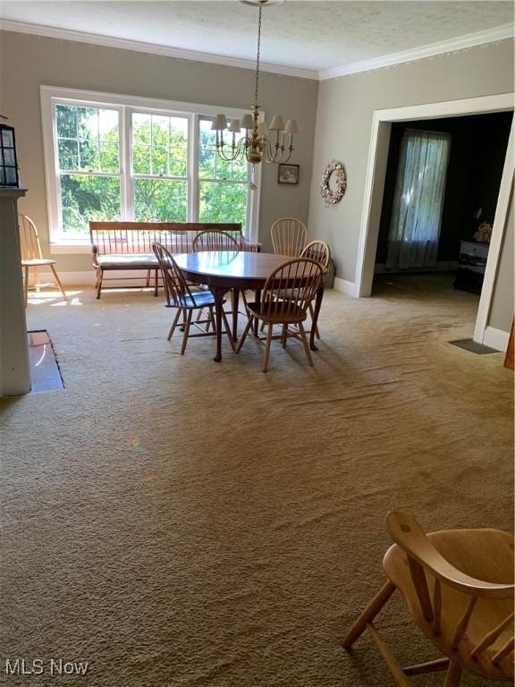 28815 State Route 7 N, Marietta, OH 45750 - dining area with an inviting chandelier, carpet flooring, baseboards, and ornamental molding