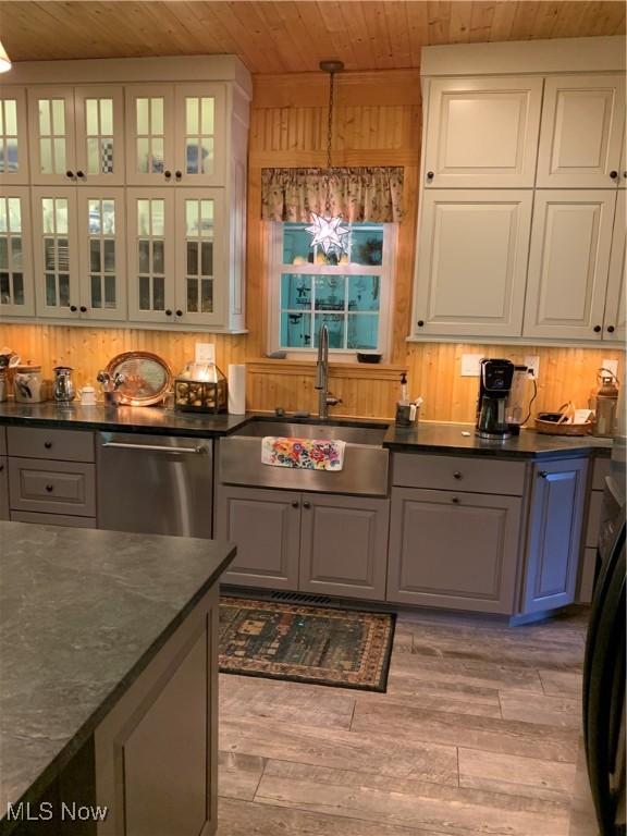 28815 State Route 7 N, Marietta, OH 45750 - kitchen with a notable chandelier, a sink, decorative light fixtures, wooden ceiling, and dishwasher