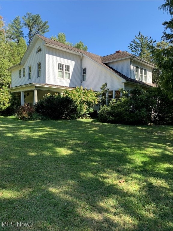 view of home's exterior featuring a lawn