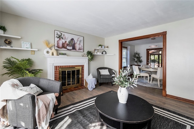 living room with hardwood / wood-style flooring and a fireplace