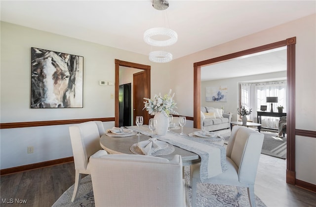 dining area with dark hardwood / wood-style floors