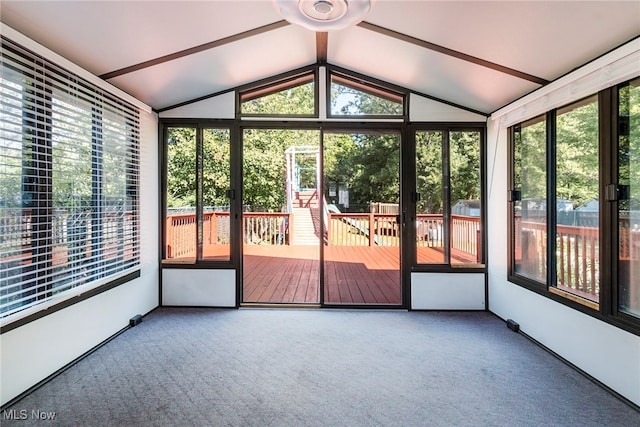 unfurnished sunroom featuring vaulted ceiling