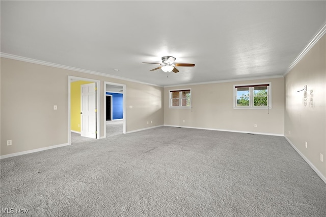 unfurnished room with ceiling fan, ornamental molding, and carpet floors