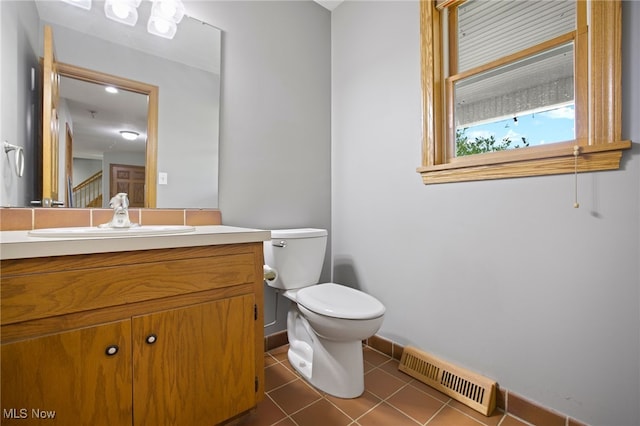 bathroom featuring vanity, toilet, and tile patterned floors