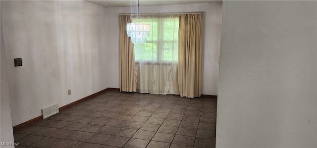 unfurnished room featuring tile patterned flooring