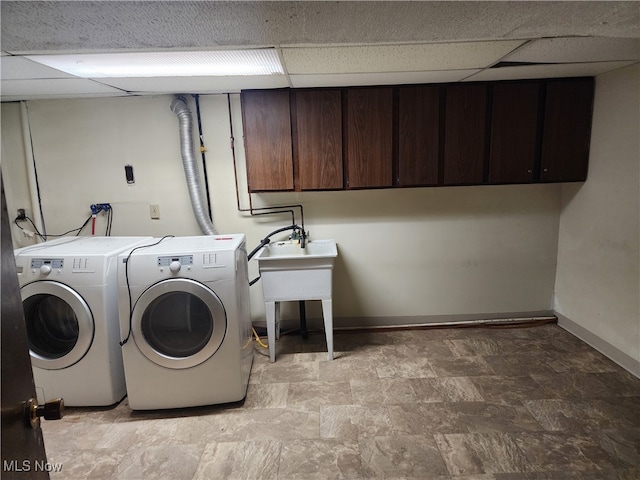 washroom with cabinets and independent washer and dryer