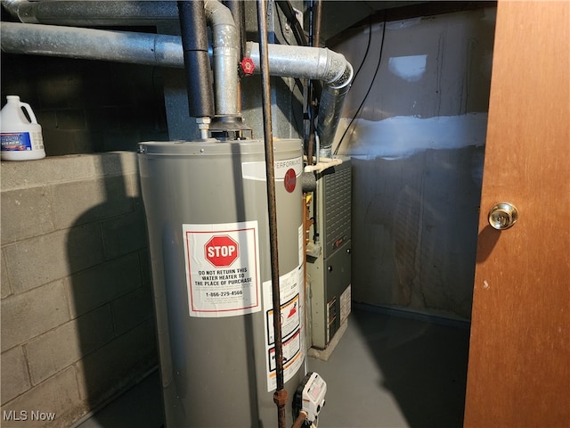 utility room featuring water heater