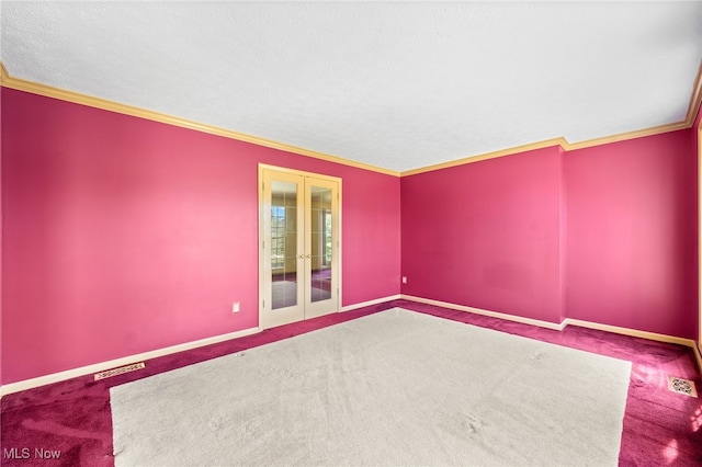 carpeted empty room with a textured ceiling and ornamental molding