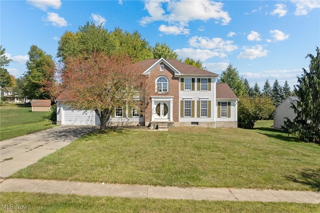 colonial-style house with a garage and a front yard