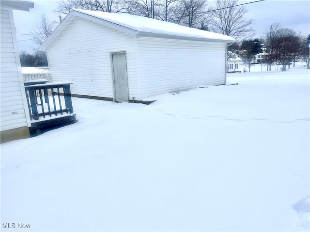 view of snow covered garage